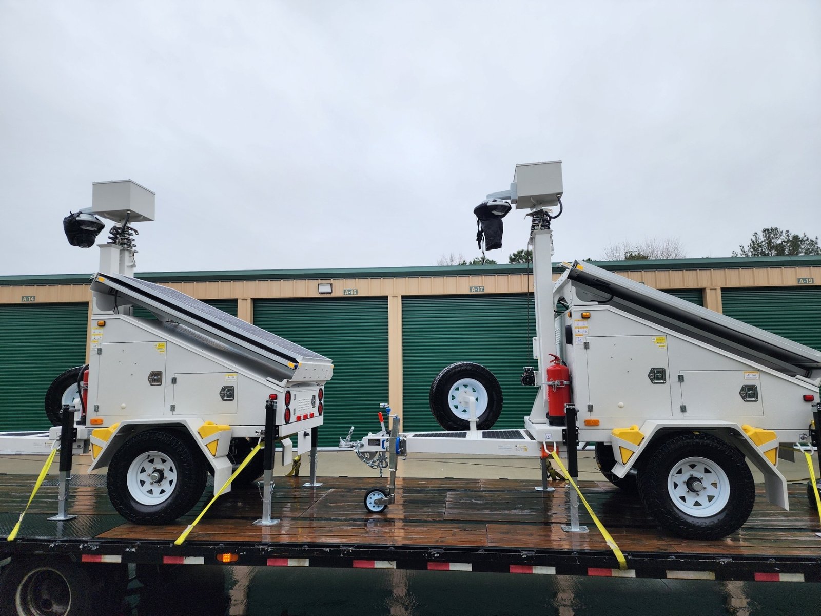 Two solar powered mobile security surveillance systems ready for delivery on trailer